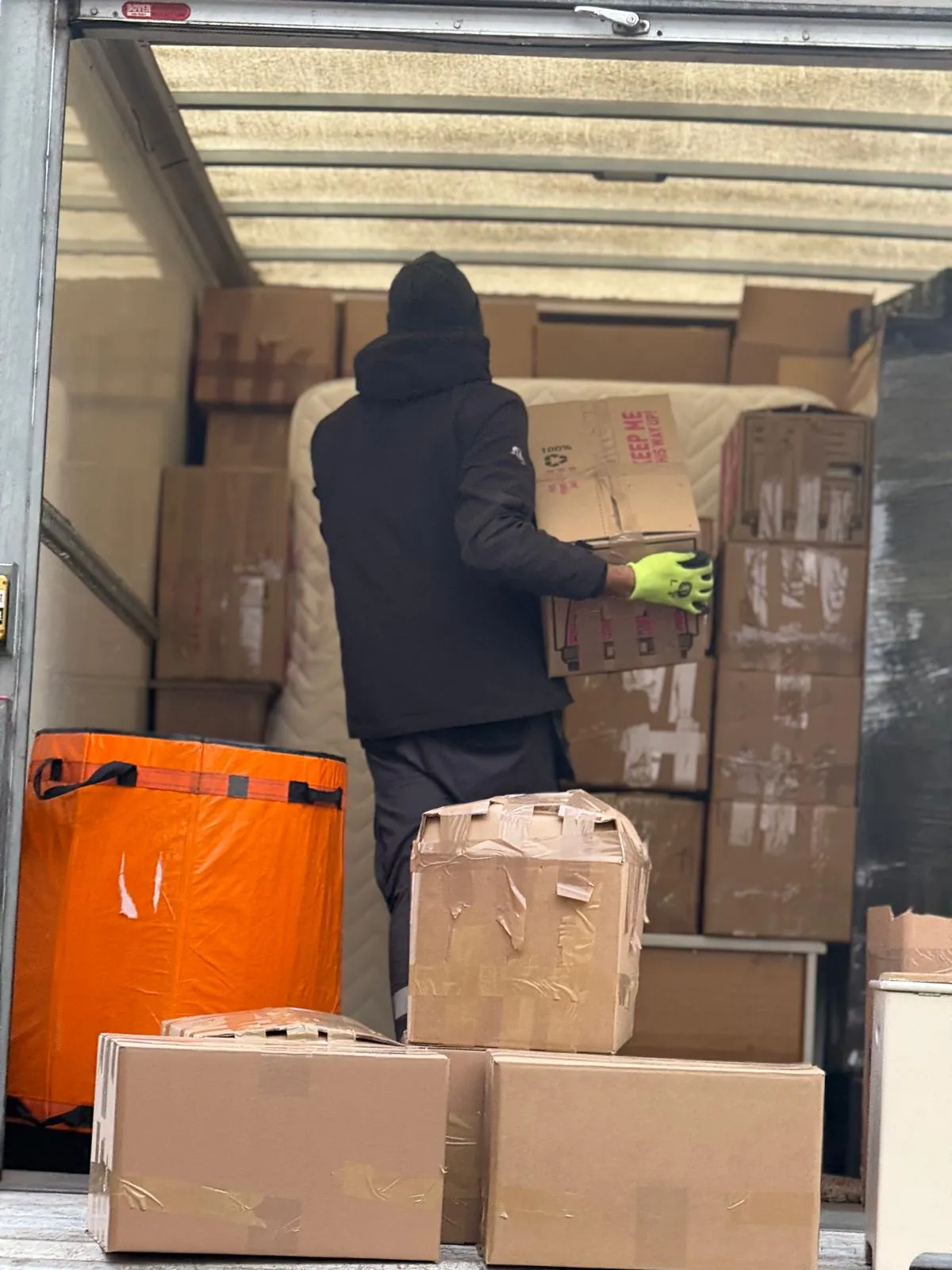 Boxes and a bed prepared for a student house move in Doncaster